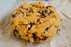 a close up of a cookie on wax paper