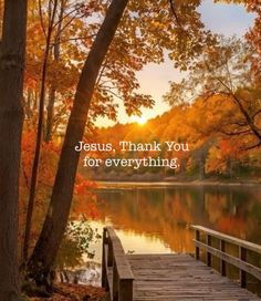 a wooden dock sitting next to a lake surrounded by trees and leaves with the words jesus, thank you for everything