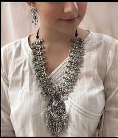 Add style and charisma to your beautiful personality with this exquisitely designed and handcrafted German Silver and oxidised alloy necklace .Pair it up with any casual, semi formal or, formal attire and gather compliments for your unique and classy choice. Ideal wear for both casual and dressy occasions Length 28-30 inches with an adjustable black dori at the back Weight 154 GM's Earrings are lightweight Note: All in stock items will be shipped from New Delhi, India within 2-3 business days af Afghani Jewelry, Oxidised Jewelry, Oxidised Necklace, Beautiful Personality, Oxidized Silver Necklace, Necklace Set With Earrings, Traditional Indian Jewellery, Temple Jewelry, Oxidized Necklace