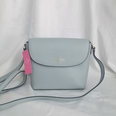 New Kate Spade Emmie Flap Crossbody Avalon Mis K8215 $299 6.4"H X 8"W (Top) X 7"W (Bottom) X 3.4"D Strap Drop: 22" Pebbled Leather Foil Embossed Logo Two Way Spade Jacquard Lining Interior: Back Slip Pocket Flap With Magnetic Snap Closure Dust Bag Not Included Imported Style No. K8215 Elegant Silver Kate Spade Bag, Kate Spade Luxury Silver Bag, Luxury Silver Kate Spade Bag, Kate Spade Silver Bag For Everyday Use, Kate Spade Silver Bag For Everyday, Kate Spade Silver Everyday Bag, Silver Kate Spade Bag For Everyday, Kate Spade Silver Bag, Embossed Logo