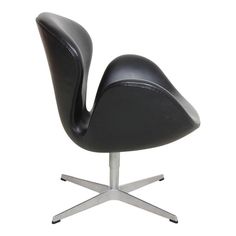 an image of a black chair with chrome legs