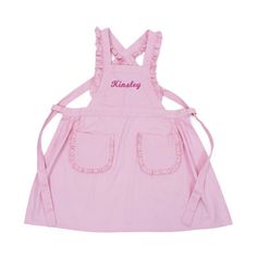 a pink apron with the name kindley written on it and two straps at the waist