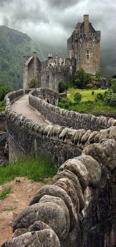 an old stone building with trees in the foreground and a photo of a castle on the other side