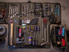 tools are laid out in a case on the floor