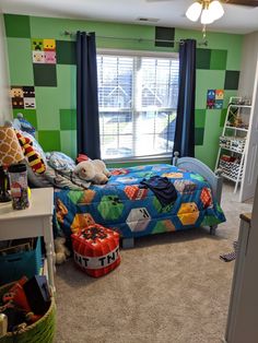 a bedroom with green walls and blue curtains