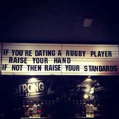 a sign that says if you're dating a rugby player raise your hand if not then raise your standards