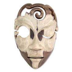 Hibiscus wood reveals the smooth features of a young man who closes one eye in a flirtatious wink. Bali's Wayan Rendah carved the sleek mask from wood. This wood varies widely in its tones and patterns, thus each mask is an absolutely unique work of art. | World Menagerie Wink at Me Modern Mask Wall Décor, Wood in Brown | 9.75 H x 6.75 W in | Wayfair | Home Decor Modern Mask, Mask Wall Decor, Cardboard Mask, Wood Mask, Mask Wall, Three Best Friends, Modern Birds, Wall Mask, Sculptures For Sale