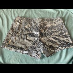 White With Silver Sequins Shorts. Spirit Halloween. Never Worn Disco Stretch Shorts, Disco Style Stretchy Shorts, Disco Style Stretch Shorts, Disco Sequined Bottoms For Summer, Trendy Sequined Summer Bottoms, Trendy Sequined Bottoms For Summer, Disco Stretch Shorts For Night Out, Stretch Disco Shorts For Night Out, Disco Style Stretch Shorts For Night Out