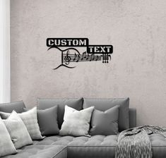 a living room with a couch, chair and wall art that says custom text on it