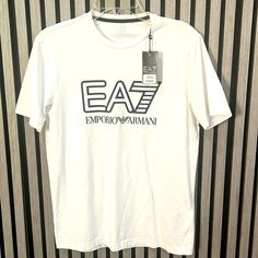 Ea7 Emporio Armani T-Shirt Medium Size 50 Eu White Logo Detail Short Sleeve Tops, White Short Sleeve Tops With Logo Detail, White Short Sleeve Top With Logo Detail, Black Fitted Shirt, Armani Shirts, Armani White, Armani Tshirt, Armani Black, Cotton Logo