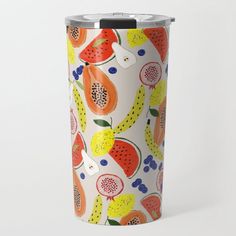 a travel mug with fruit print on it