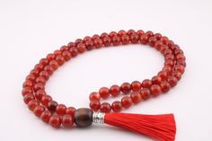 Only quality gemstones used in my Necklaces, Hand made by myself, made with cord. Red Agate Mala Necklace. 1. Cleaning: Gently wipe with a soft, damp cloth to keep it looking beautiful  2. Storage: Store in a cool, dry place, ideally in a soft pouch, to avoid scratches  3. Avoid: Keep away from harsh chemicals and prolonged water exposure to preserve the gemstone's natural integrity  How to Order: Select Your Size: Choose your size from the available options.  Add to Cart: Click "Add to Cart" to Adjustable Agate Hand-strung Mala, Adjustable Hand-strung Agate Mala, Adjustable Agate Mala With Round Beads, Adjustable Agate Mala With 8mm Beads, Handmade Agate Mala For Meditation, Spiritual Agate Mala With Round Beads, Spiritual Agate Mala With 108 Beads, Agate Mala With 108 Beads Gift, Agate Mala With 108 Beads As Gift