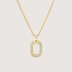 A gold chain and pendant, inspired by the interlinking of cufflinks, brings this necklace to life. As part of our Tailored Collection we studied all elements of suiting, and were fascinated by how a cufflink weaves itself through a button hole and connects to offer a practical yet beautiful finish. The oval pendant with diamond tracing hangs onto the chain with a hook that has a diamond at its center. The frame of the pendant measures 17mm and has 25 diamonds set within. If ordered in rose gold, the chain will be our Rollo chain. All features can be customized! Please contact us if you wish to make changes, we love making custom designs. All of our jewelry is carefully handmade in our atelier. *HC diamond are all conflict-free diamonds To order by phone 972-72-2991000 Yellow Gold Jewelry With Adjustable Chain And Oval Pendant, Yellow Gold Oval Pendant With Adjustable Chain, Yellow Gold Jewelry With Oval Pendant And Adjustable Chain, Elegant Oval Pendant Chain Jewelry, Elegant Necklace With Rectangular Pendant And Box Chain, Elegant Gold Plated Cable Chain Jewelry, Elegant Gold-plated Jewelry With Cable Chain, Elegant Necklace With Box Chain And Rectangular Pendant, Yellow Gold Jewelry With Adjustable Chain And Rectangular Pendant