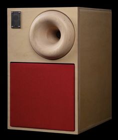 an old fashioned speaker with a red cover on it's front and back sides