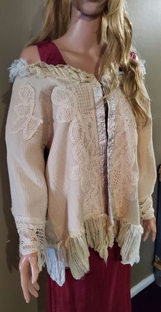 This pretty muslin and lace jacket is lightweight, soft and flowing and can be worn on or off the shoulders.   It has one button for closure and features a gorgeous French script stamped silk ribbon.   Perfect for someone who loves hippy and boho fashion, it can be added to any attire .  A totally original design, handmade, one of a kind.  AU size 14-16. Bohemian Cotton Lace Patchwork Top, Cotton Long Sleeve Outerwear With Lace Trim, Long Sleeve Cotton Outerwear With Lace Trim, Bohemian Cotton Lace Blouse With Lace Trim, Spring Lace Top With Lace Work For Daywear, Spring Bohemian Embroidered Lace Top, Spring Lace Patchwork Top For Festivals, Bohemian Top With Lace Collar For Fall, Bohemian Tops With Lace Collar For Fall