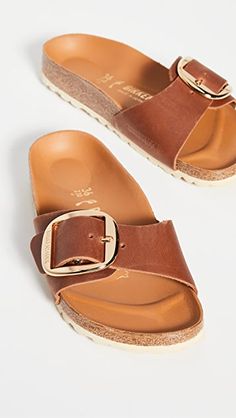 Leather: Cowhide Molded cork footbed with leather lining Narrow fit Adjustable buckle strap EVA sole Made in Germany This item cannot be gift-boxed | Birkenstock Madrid Big Buckle Sandals Bercanstock Sandals, Cognac Outfit, Madrid Birkenstock, Safari Clothes, Madrid Big Buckle, Birkenstock Madrid Big Buckle, German Dress, Outfits Vacation, 2023 Wishlist