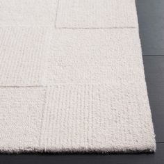 a white rug with squares on it