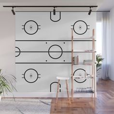 a white wall with black lines and circles on it