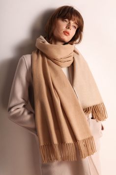 The Emes Shop scarf is detailed with a minimalist design. Features a fringe hem. knit material. and long length.MATERIAL:100% BrushedWool Blend Solid Color Fringe Scarf For Fall, Elegant Fringed Scarves For Fall, Classic Beige Scarves For Fall, Classic Beige Scarf For Fall, Cream Wool Scarf For Fall, Winter Beige Fringe Shawl, Beige Fringed Winter Shawl, Beige Fringed Shawl For Winter, Elegant Winter Shawl With Fringe