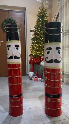 two christmas decorations made to look like nutcrackers