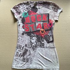 New Rock Star Newspaper Print With Skulls T-Shirt (Medium) Condition: New Without Tags, Never Worn Color: Multi Colored; Newspaper Pattern, Red Lettering And Multi Colored Skulls Length: 25.5 - 26 Inches Newspaper Pattern, Disneyland Birthday, Goth Clothes, Striped Shirt Women, North Face Shirts, Newspaper Print, Newspaper Printing, Skull Tee, Brown Tshirt