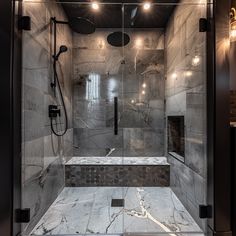 a walk in shower sitting inside of a bathroom