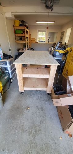 an unfinished workbench in a garage with lots of tools