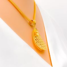 Unleash your inner queen with our Majestic Mesh Drop 22K Gold Pendant Set. Crafted from 22k yellow gold, weighing 8.1 grams, this set embodies regal charm. The pendant, measuring 1.4" in length, is accompanied by matching earrings, 1.2" in length, featuring convenient push back posts. Elevate your fashion game with this 3-piece set, chain not included, and reign with unparalleled elegance. PRODUCT DETAILS Gold Purity(karat): 22k Gold Weight(grams): 8.1 Item Finish: Yellow Gold Pendant Length: 1. Gold Necklace With Detachable Pendant For Ceremonial Use, Gold Necklace With Detachable Pendant For Ceremonial Occasions, Traditional Yellow Gold Oval Pendant Jewelry, Gold Oval Pendant Necklace For Ceremonial Occasions, 22k Gold Locket Jewelry, 22k Gold Filigree Pendant Necklace, Yellow 22k Gold Round Pendant Jewelry, Gold Locket Necklace In 22k Gold, Elegant 22k Gold Locket Necklace