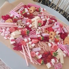 a platter filled with lots of different types of food on top of a table