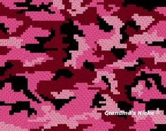 pink and black camouflage fabric with hearts on it