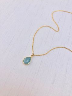 Aquamarine Necklace, March Birthstone, Minimal Aquamarine Pendant, Aquamarine Gold Layering Jewelry, Aqua Blue Drop, Gift for her under 25 This simple dainty necklace features a small aquamarine teardrop pendant bezel framed in 14k Gold Filled. The dainty aquamarine pendant is suspended from a delicate gold filled cable chain. This is a 100% natural gemstone, full of healing properties. This necklace is simply perfect for everyday wear and is perfect for layering with other pieces in your collec Blue Teardrop Necklace With Delicate Chain, Dainty Blue Teardrop Pendant Necklace, Blue Teardrop Minimalist Necklace, Aquamarine Birthstone, Layering Jewelry, Jewelry Summer, Aquamarine Pendant, Aquamarine Necklace, March Birthstone