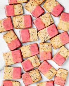 some kind of food that is on top of a white table with pink and yellow squares