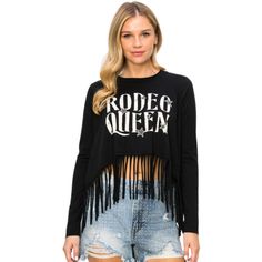 Vocal Rodeo Queen Black Fringe Long Sleeve Tee Shirt Top S-1xl Nwt There Will Be No Doubt That You Are The Queen Of The Rodeo When You Wear This Adorable Long Sleeve Top From Vocal Apparel. Just In Time For Spring And Summer! 100% Cotton Long Sleeve Slim Fit Crew Neckline With Raw Edge Fringe Sharkbite Hemline Cropped In Front And Back Rodeo Queen Screen Print With Bling Stone Embellishments On The Stars Nwt Sizes Small To Extra Large Cowgirl, Rodeo, Western, Horse, Fringed, Yellowstone, Dutton, Cowgirl Rodeo, Embellished Shirt, Queen Black, Rodeo Queen, Long Sleeve Tee Shirt, Western Horse, Black Fringe, Long Sleeve Tee Shirts, Black White Fashion