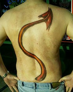 a man with a tattoo on his back