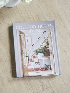 the country house living book is sitting on a table