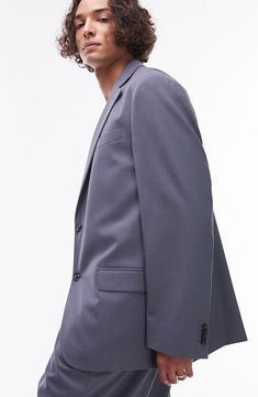 Stride through the office with confidence in this sleek jacket made with notched lapels and designed for a relaxed fit. 31" length (size 42) Two-button closure Notched lapels Nonfunctional four-button cuffs Chest welt pocket; front flap pockets Lined 69% polyester, 29% viscose, 2% elastane Dry clean Imported Modern Spring Suits With Double Button Closure, Modern Suits With Double Button Closure For Spring, Modern Double Button Spring Suit, Classic Sport Coat With Hidden Button Closure For Office, Modern Double Button Closure Suits For Office, Modern Office Suits With Double Button Closure, Modern Double Button Suits For Office, Modern Semi-formal Blazer With Lapel Collar, Tailored Formal Button-up Outerwear