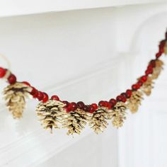 a garland with pine cones and red beads