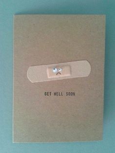 a card with a button on it that says get well soon in front of a blue background