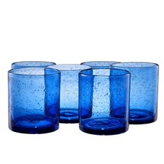 four blue glasses sitting next to each other