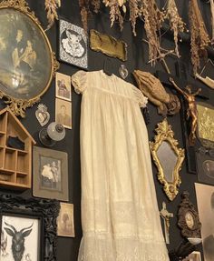 a wall covered in pictures and framed objects