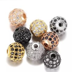 many different colored beads with black and white diamonds