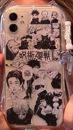 someone holding up their cell phone case with anime pictures on it and the back cover is clear