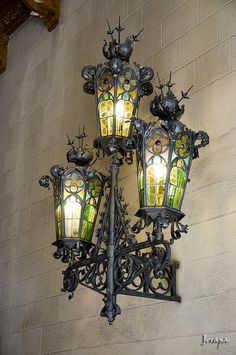 an ornate light fixture with stained glass windows