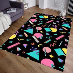 a black area rug with colorful shapes on it