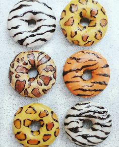 six donuts with different designs on them