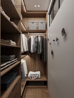 a walk in closet with wooden shelves and clothes hanging on the wall next to it