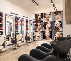 a hair salon with chairs and pictures on the wall in front of it, all showing different types of women's hair