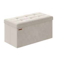 an upholstered storage bench with buttons on the top and bottom, in white fabric