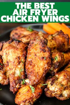 the best air fryer chicken wings with carrots and celery on a black plate