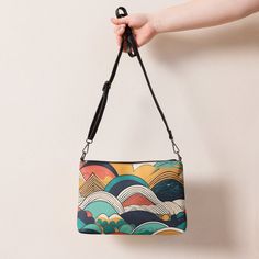 Retro Colored Abstract Pattern Crossbody Bag Elevate your style with our unique crossbody bag featuring a retro colored abstract pattern. Made of premium faux leather and lined with 100% polyester, this bag is both stylish and durable. The dark gray hardware adds a touch of sophistication, while the zip-top closure and multiple inside pockets keep your essentials secure and organized. What sets this crossbody bag apart is its versatility. With removable wrist and shoulder straps, you can easily Multicolor Crossbody Shoulder Bag For On-the-go, Multicolor Crossbody Shoulder Bag With Mobile Phone Bag, Multicolor Crossbody Shoulder Bag, Multicolor Clutch With Mobile Phone Bag, Retro Multicolor Crossbody Bags, Colorful Crossbody Travel Bag, Multicolor Shoulder Bag Pouch For Everyday Use, Green Crossbody Pouch, Multicolor Crossbody Shoulder Bag With Detachable Strap